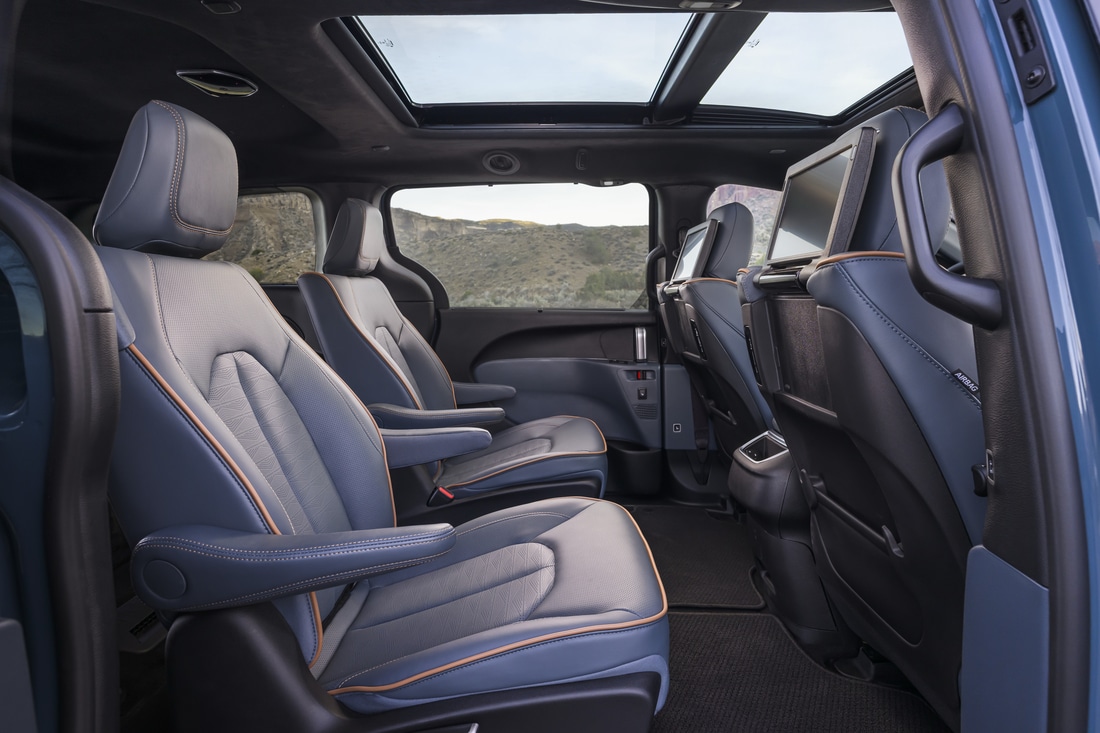 2027 Chrysler Pacifica interior second-row captain's chairs in Blue Agave Nappa leather with dual-pane panoramic sunroof