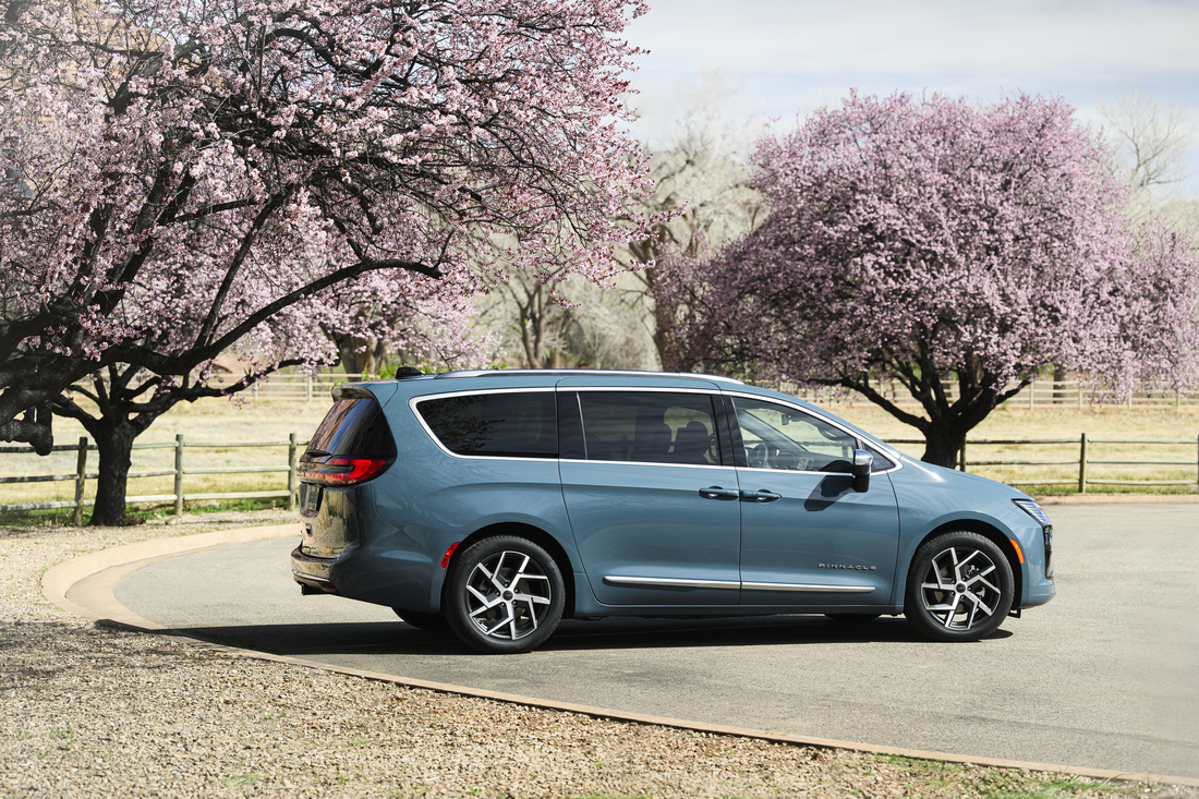 2027 Chrysler Pacifica Blue Agave exterior side profile showing dual power-sliding doors and 20-inch wheels