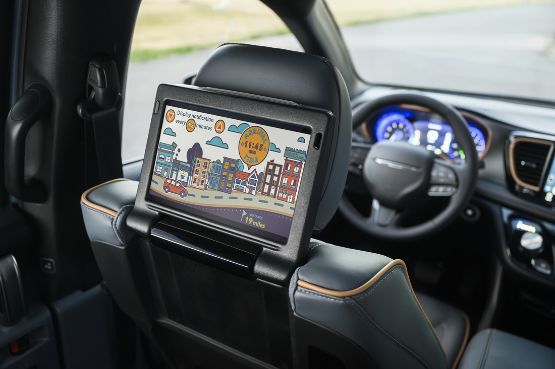 2027 Chrysler Pacifica Uconnect 5 front display and rear seatback 10.1-inch touchscreen showing family trip arrival tracker